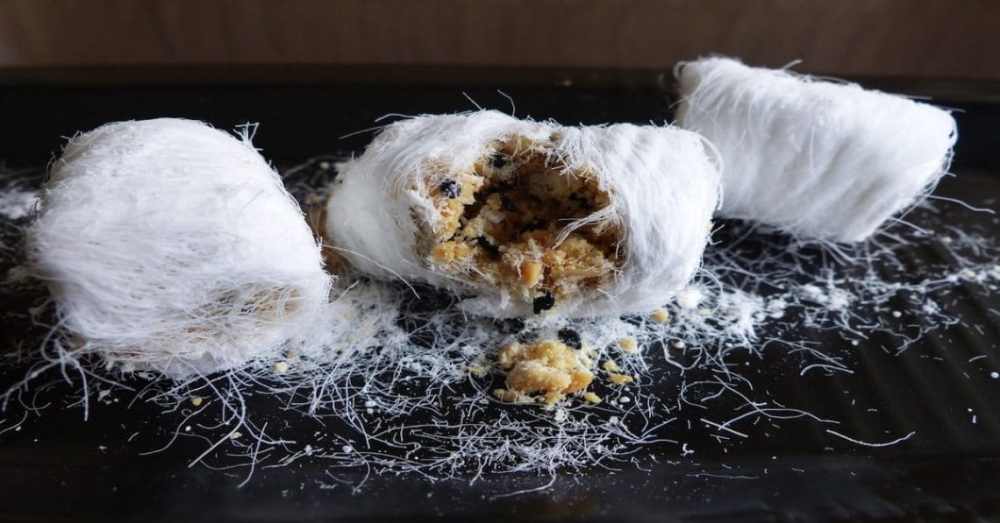 how-eat-dragon-beard-candy-inside-outside-black-background